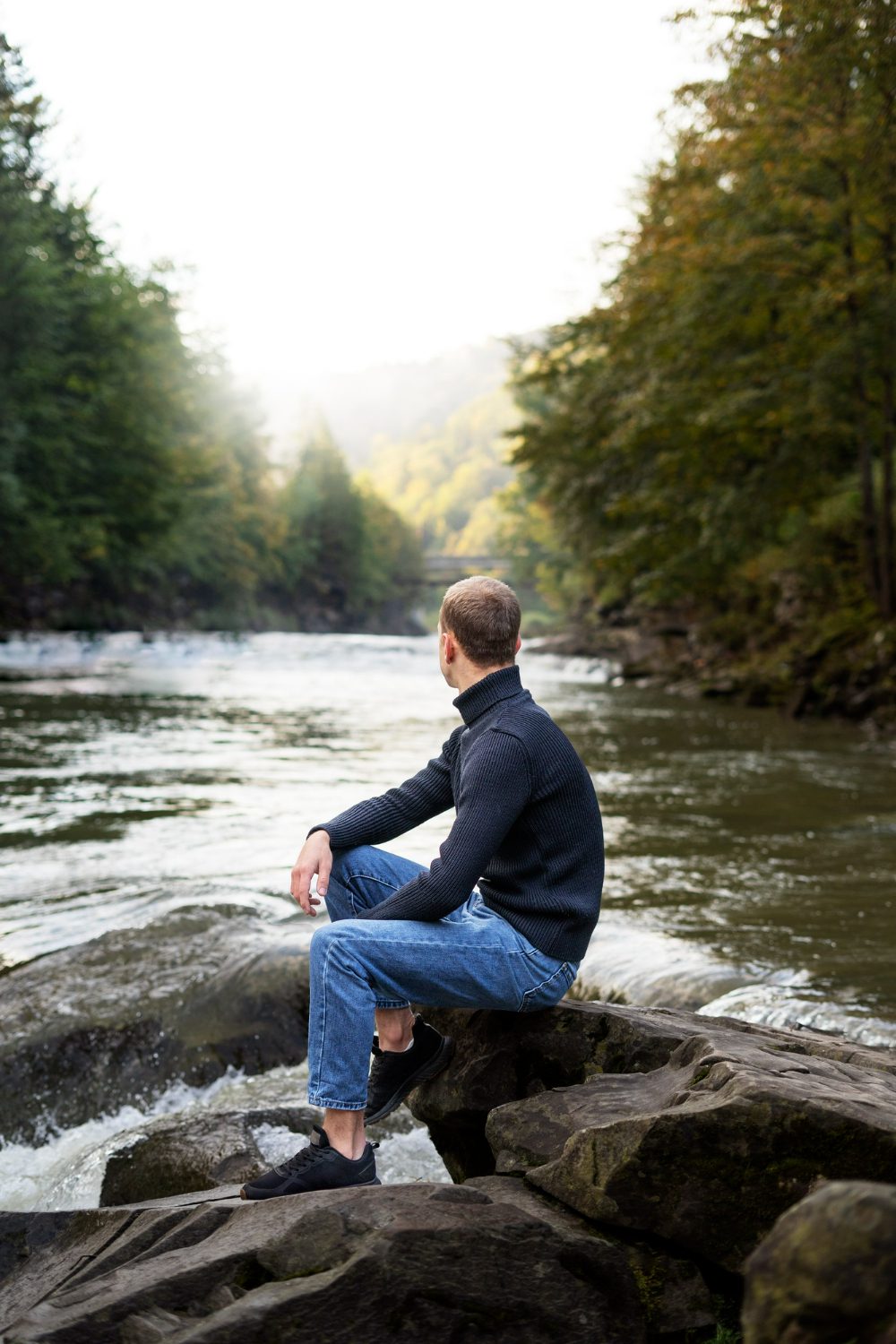 side-view-man-sitting-by-river side-view-man-sitting-by-river